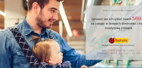 mężczyzna z dzieckiem w nosidełku robiący zakupy